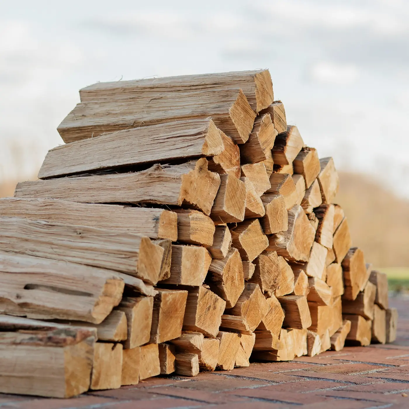 Neatly stacked seasoned hardwood ready for processing